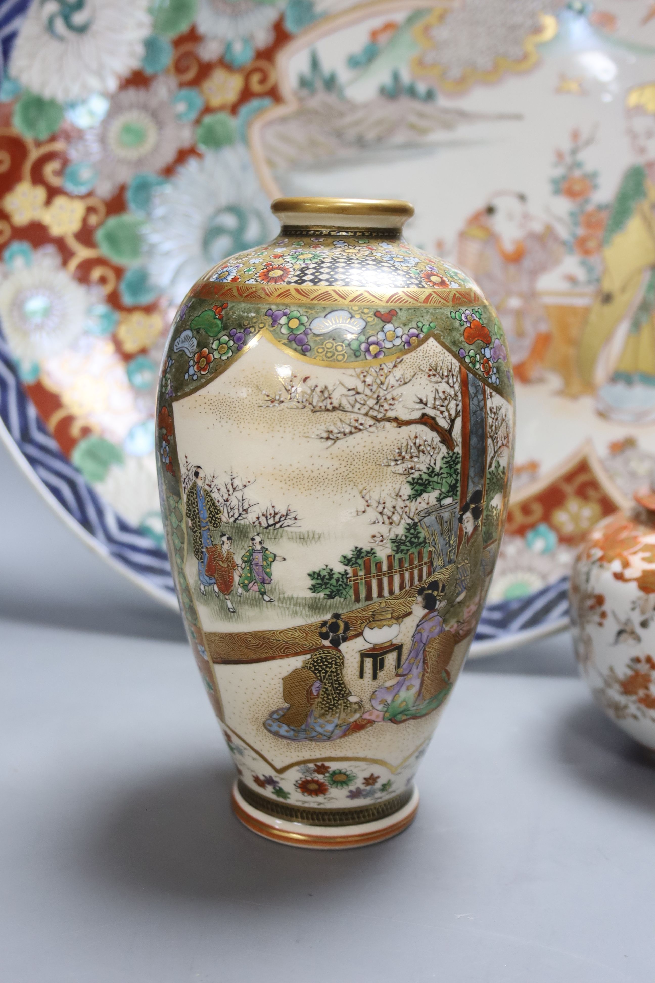 A Japanese Imari charger, a Kutani jar and cover and a Satsuma vase, diameter 40cm